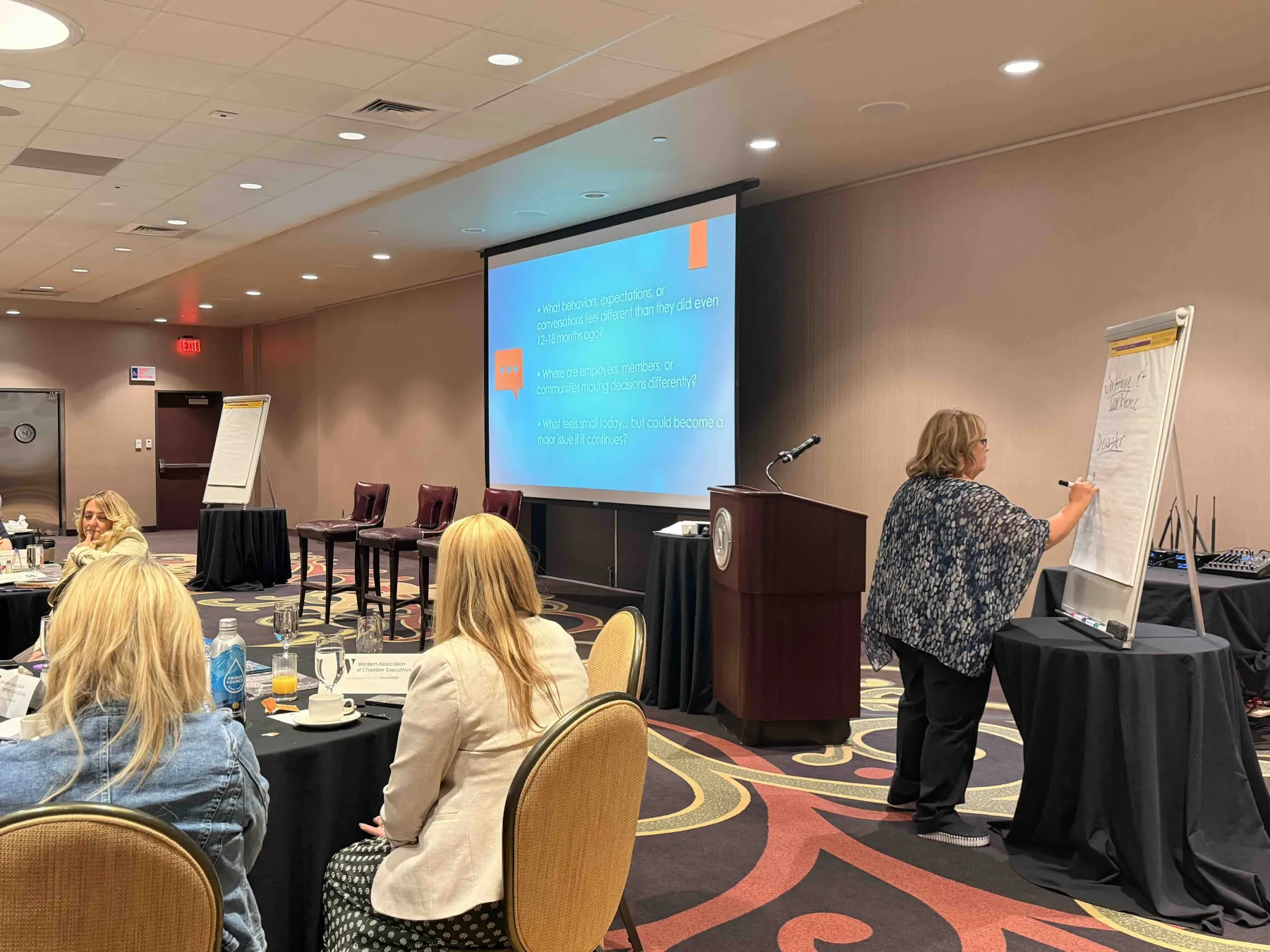 Kelly Rose Hall facilitating a strategic working session at a flipchart